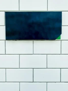 Small black backboard with space for add text on the brick background Stock Photos