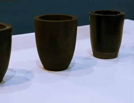 The small black ceramic crucible for transfer molten metal into mold Foto stock