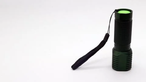 Small black flashlight isolated Stock Photos