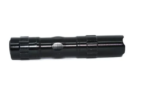 Small black flashlight tactical for camping and hiking trails isolated on whi Stock Photos