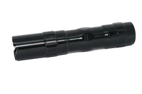 Small black flashlight tactical for camping and hiking trails isolated on whi Stock Photos