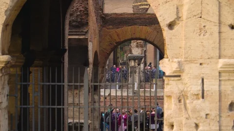 A small black gate on the small arch of the Colosseum in Rome in Italy Stock Footage 85615028
