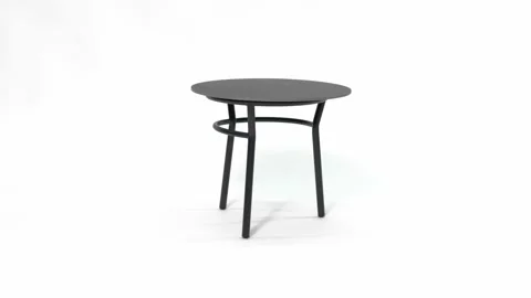 Small black metal frame table with a round table top in dark graphite granite. Stock Footage 219427106