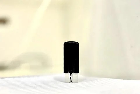 Small Black Plastic Stamp Tool on White Background Stock Photos