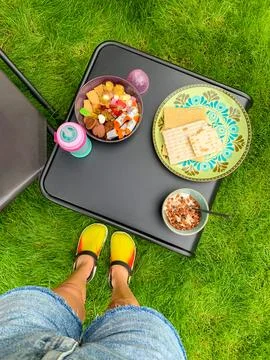 A small black table on the grass with sweets and Swedish candy for a snack Stock Photos