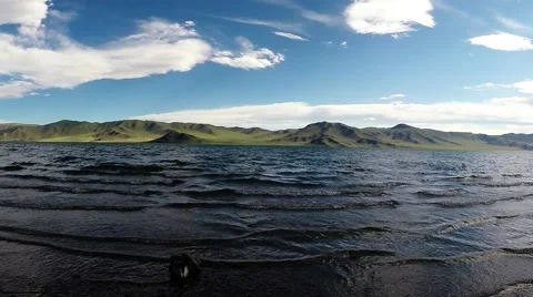 Small Black Waves Breaking on Shore of Lake Panorama From Right to Left Stock Footage 60582563