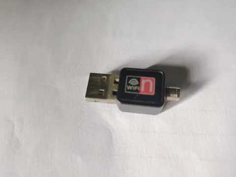 A small black WiFi USB wireless adapter with antenna  technology device for.. 스톡 사진