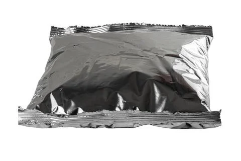 Small blank single-use crumpled aluminum foiled plastic bag isolated on white Stock Photos