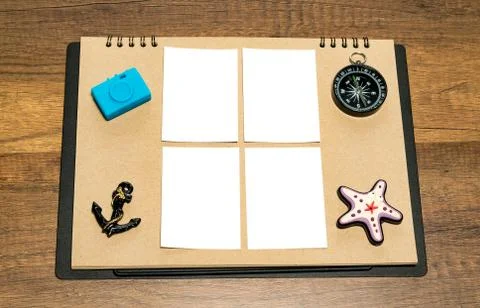 Small blank white sheet on brown paper with blue camera Foto stock