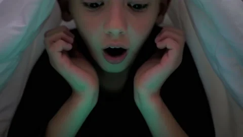 Small blond boy kid experiences emotion fear, covers his face with his hands Stock Footage 229542646