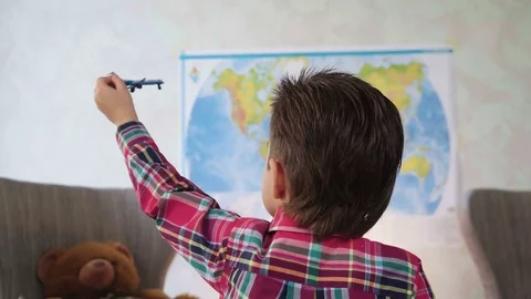 Small blonde boy kid play miniature airplane dreaming to be pilot as future Stock Footage 78708201