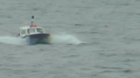 Small blue and white motor boat on choppy sea bouncing over waves Stock Footage 36840233