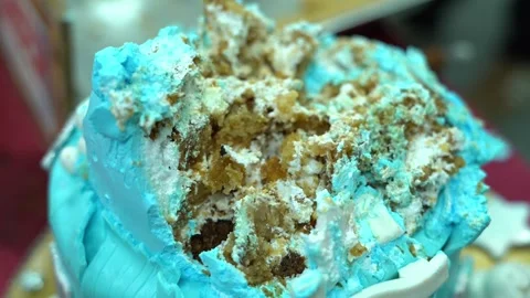 Small blue birthday cake after being smashed by child on his birthday. Stock Footage 168682044
