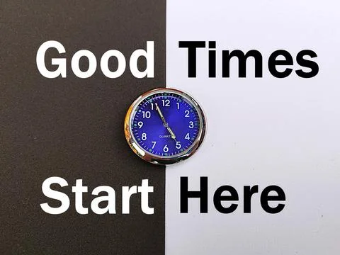 Small blue clock with black and white background saying good times start here Stock Photos