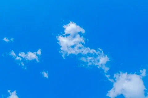 Small blue cloudy sky background Stock Photos