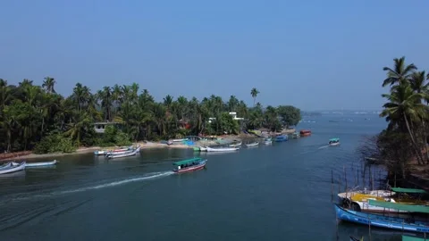 Small blue ferryboat floats on Nerul river in Aguada, Goa, india. A crowd of peo Stock Footage 209222433