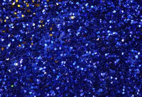 Small blue glitter as a background Stock Photos