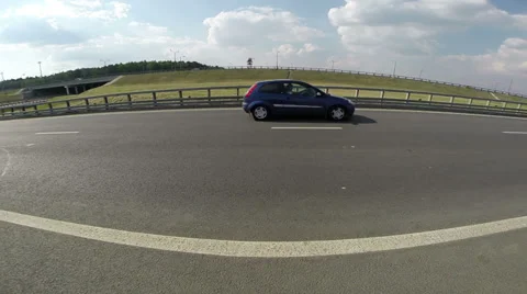 Small blue hatchback on the highway Stock Footage 38868905