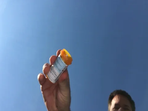 Small Blue Pills Falling - Slow Motion Vidéo 76247885