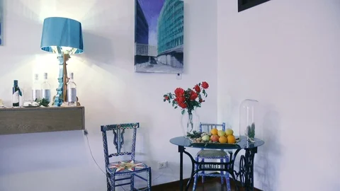 Small blue table with fruit basket Stock Footage 86171931