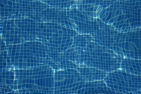 Small blue tiles in the pool. The bottom of the pool is visible through the Foto stock
