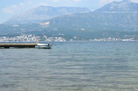 Small boat attached to a dock Stock Photos