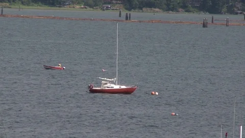 Small boat in a bay Stock Footage 75239797
