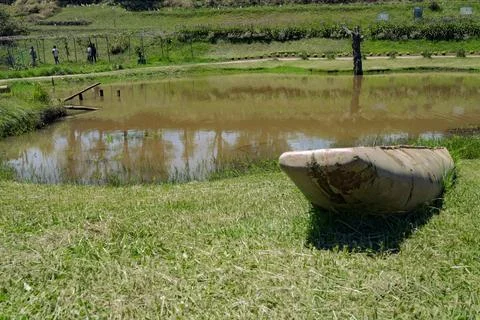 A small boat beached Stock Photos