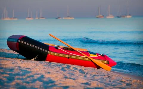 Small boat on beach:gn Stock Photos