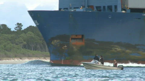 Small boat big container ship bow Stock Footage 612094