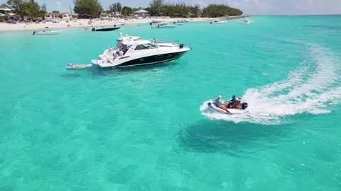 Small boat at Bimini beach speeding Stock Footage 232437479