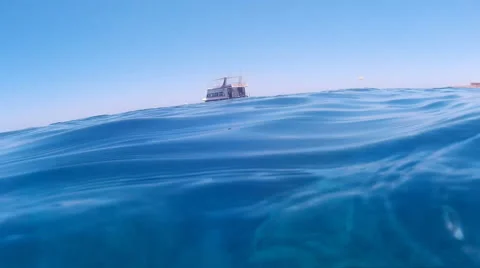A small boat on the blue waves of the ocean Stock Footage 68367425