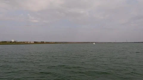 Small boat in the center of the bay Stock Footage 285140744