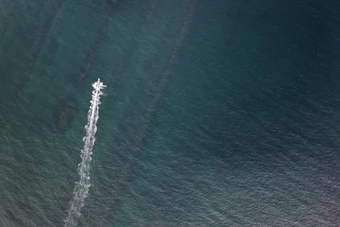 Small boat create white waves Stock Photos
