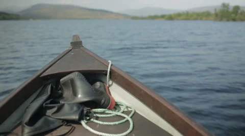 Small boat cutting through the water on a sunny day Stock Footage 58643836