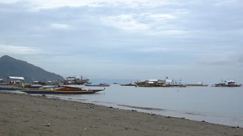 Small boat docking in populated area in cloudy afternoon Stock Footage 113216101