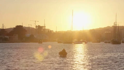 A small boat during sunset Stock Footage 74816405