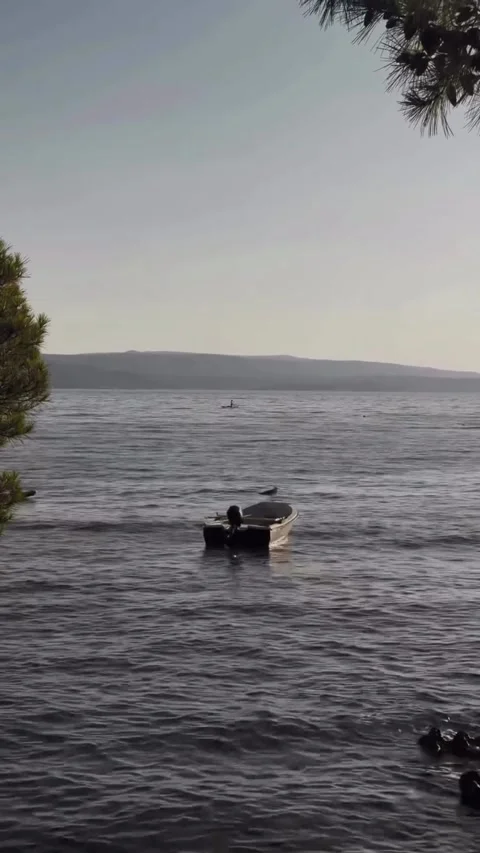 Small Boat Floating on Calm Sea 库存影片 340872026