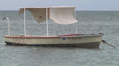 Small boat floating closeup Видео 31273761