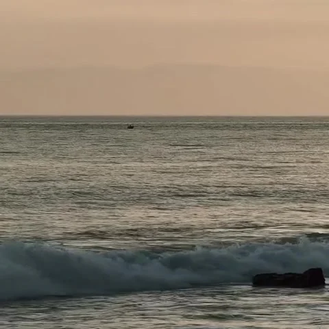 Small Boat Floating on Ocean Waves at Sunset Horizon Stock-Footage 342265775