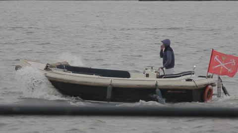 A small boat floating in the sea Stock Footage 36900089