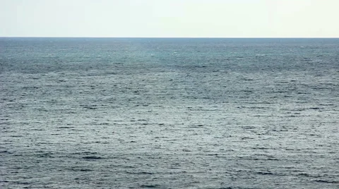 Small boat floating on the water surface of the sea Stock Footage 54569258