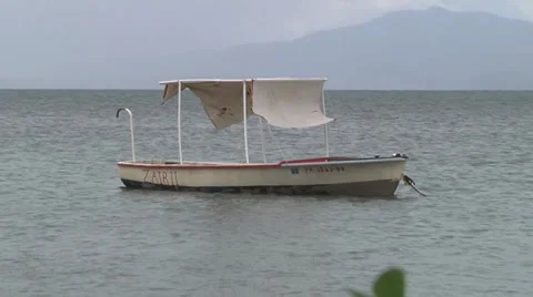 Small boat floating zoomout Stock Footage 31268392