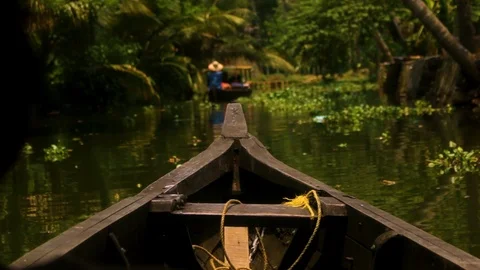 Small boat going down the river Stock Footage 95872844