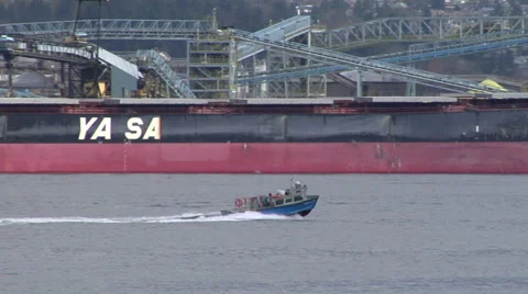 Small boat going out of busy port Stockbeeldmateriaal 44122770
