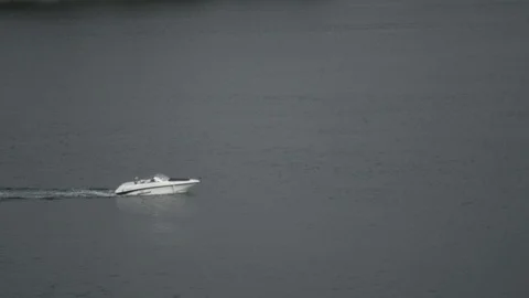 Small boat going by on water Stock Footage 126791747