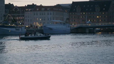 Small boat in harbor at dusk 動画素材 125625321