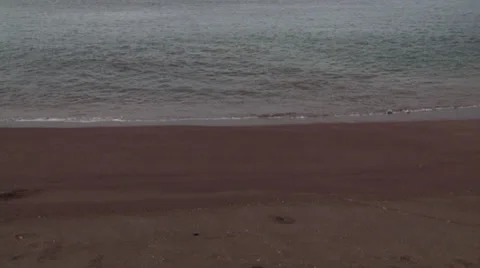 A small boat heading towards the beach and sea of an island in the Galápagos. Stock Footage 39479629