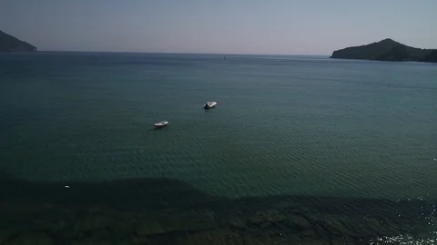Small Boat Left Floating On Sea Green Water Stock Footage 119834905