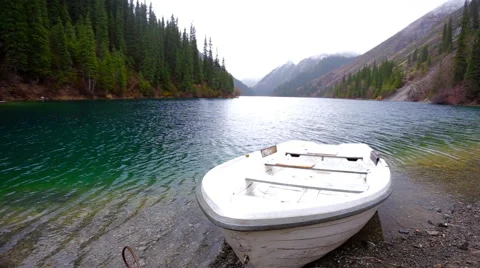 The small boat on the mountain lake Video stock 63552663